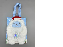  decorative holiday gift bag featuring a plush Abominable Snowman or Yeti character wearing a Santa hat. 