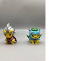 Set of 2 collectible PVC figures of Pikachu cosplaying as Ultraman characters, specifically Pikachu as Ultraman Tiga Set of 2 collectible PVC figures of Pikachu cosplaying as Ultraman characters, specifically Pikachu as Ultraman Tiga