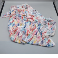 Scrap fabric with a rainbow pattern.