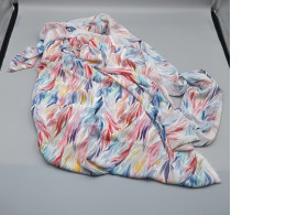 Scrap fabric with a rainbow pattern.