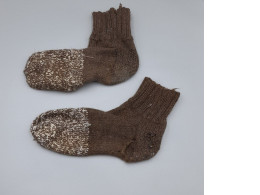 Traditional hand-knitted wool socks, dark green.