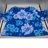women's blue floral printed top featuring short sleeves and a round neckline. 