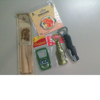 A souvenir set from Thailand, including a bookmark, magnet, and 3 bottle openers.