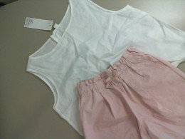Children's set of pink shorts and a white blouse Children's set of pink shorts and a white blouse