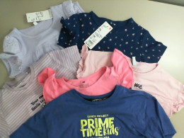 Set of 6 children's t-shirts in different colors Set of 6 children's t-shirts in different colors