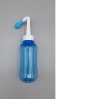 A nasal rinse bottle, specifically a 300ml Netipot device. A nasal rinse bottle, specifically a 300ml Netipot device.