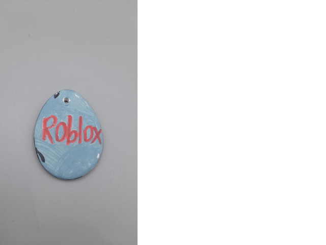 handcrafted Roblox-themed pendant or keychain. handcrafted Roblox-themed pendant or keychain.