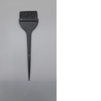 a salon-style hair coloring brush used for applying dye or treatments uniformly. 