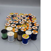 Set of 43 assorted sewing threads on spools. 