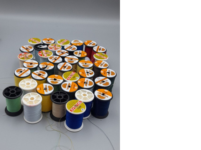 Set of 43 assorted sewing threads on spools. Set of 43 assorted sewing threads on spools.