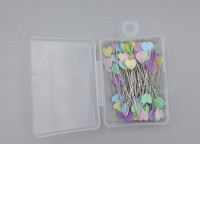  pastel-colored, heart-shaped straight quilting pins, often packaged in a clear plastic container. 