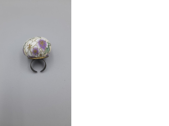 adjustable ring pin cushion used for holding sewing pins while working. adjustable ring pin cushion used for holding sewing pins while working.